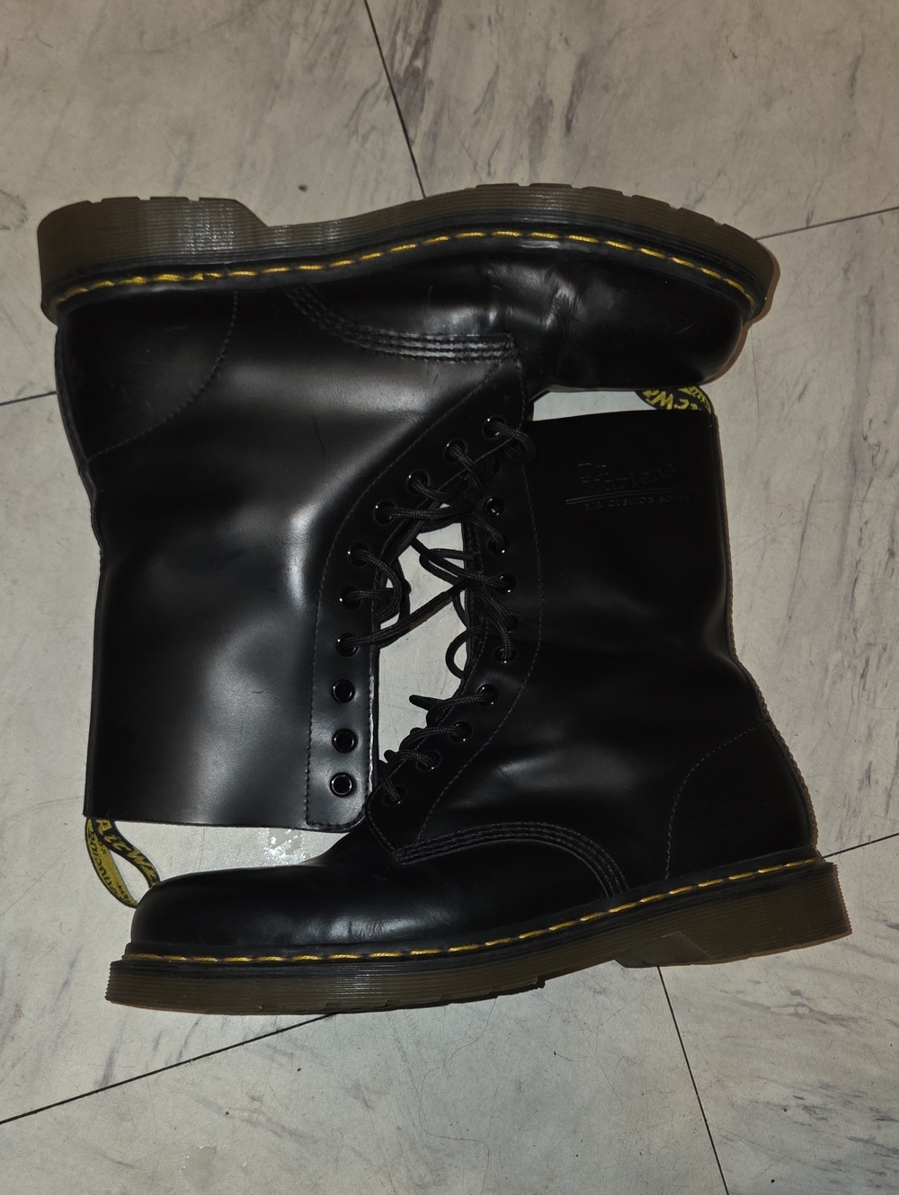 Dr. Martens Black Leather 10-Eye Lace-Up Combat Boots with Yellow Stitching
